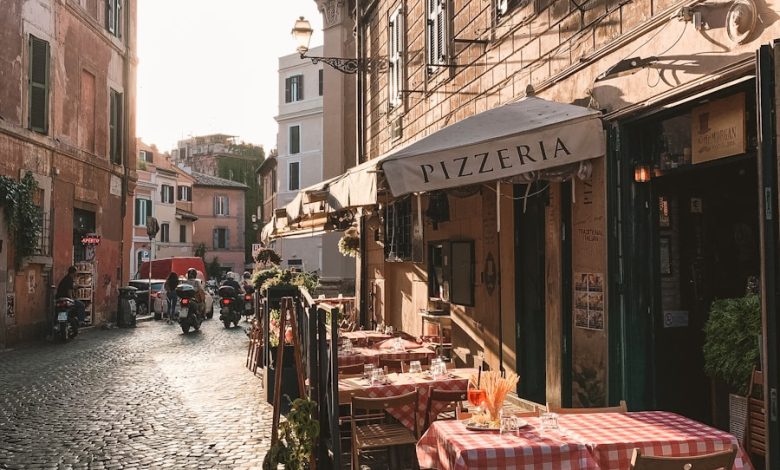 carriage and table on store front beside houses